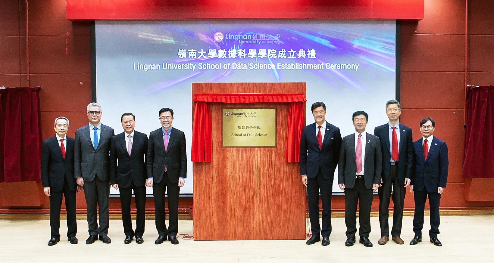 Lingnan University announces the establishment of the School of Data Science. Prof Dong Sun, Secretary for Innovation, Technology and Industry (fourth from left), Mr Tim Lui Tim-leung, Chairman of the University Grants Committee (UGC) (third from left), Dr Rocky Cheng Chung-ngam, CEO of Cyberport (second left), Mr Augustine Lui Ngok-che, Chairman of Lingnan Education Organization (left), Council Chairman Mr Andrew Yao Cho-fai (fourth from right), President Prof S. Joe Qin (third from right), Vice-President (Research and Innovation) Prof Xin Yao (second right), and Acting Dean of the School of Data Science and Associate Vice-President (Strategic Research) Prof Sam Kwong Tak-wu (right) unveil the plaque for the School of Data Science. 